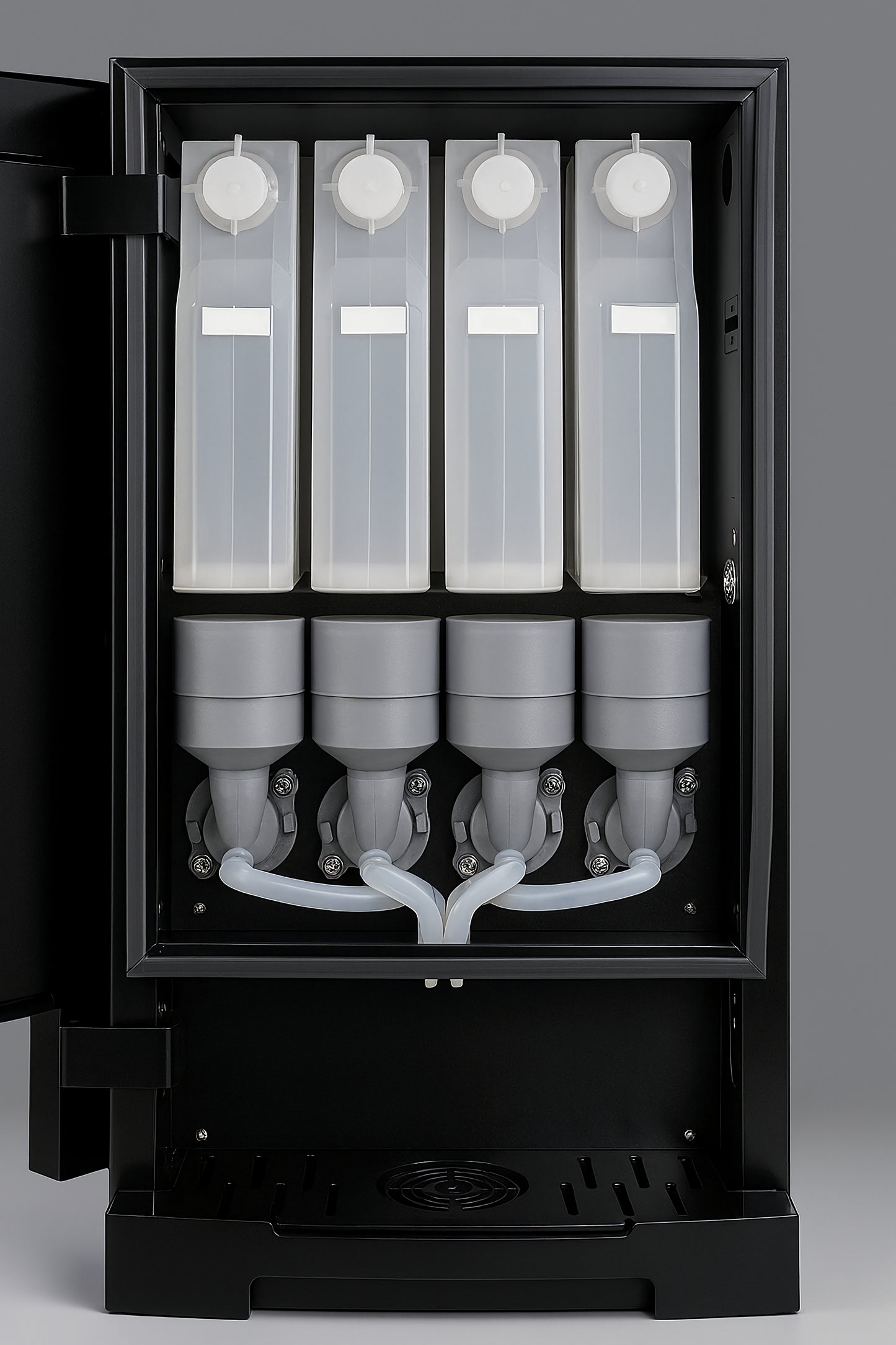 Internal view of chai machine showing 4 canisters and dispensing system