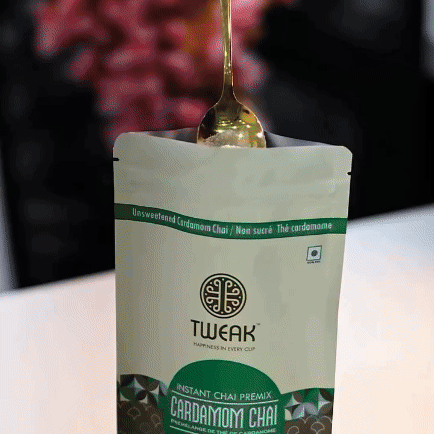 GIF showing a spoon scooping instant tea premix from the pouch — part of the “Scoop, Pour, Stir” 3-step guide for making chai easily at home with Chai City.