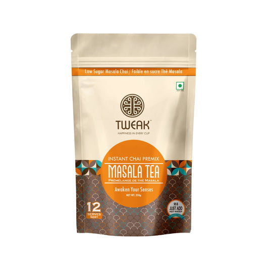 A steaming cup of Indian masala chai with visible spices and creamy texture
